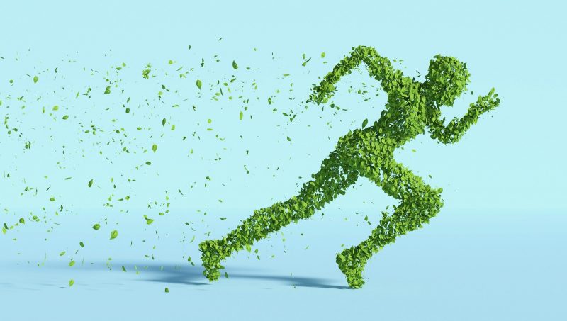 Das Bild zeigt eine sprintende Person, die aus grünen Blättern besteht.