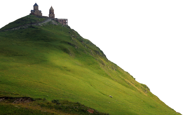 Das Bild zeigt ein Kloster auf der Spitze eines grün bewachsenen Berges.